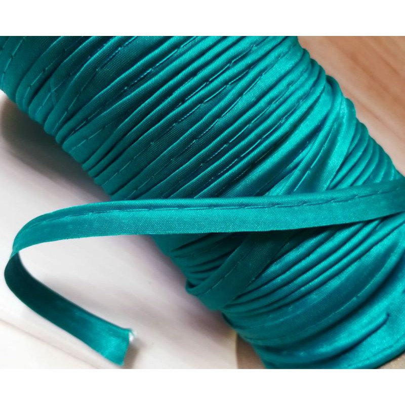 

per rol isi 144yard/125meter,pita bisban warna hijau toska lebar 1.2cm