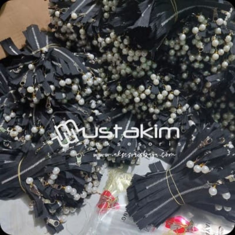 resleting mutiara - harga per 1 lusin - minimal beli 10 lusin -resleting bandul mutiara - supplier aksesoris konveksi garmen - zipper mutiara