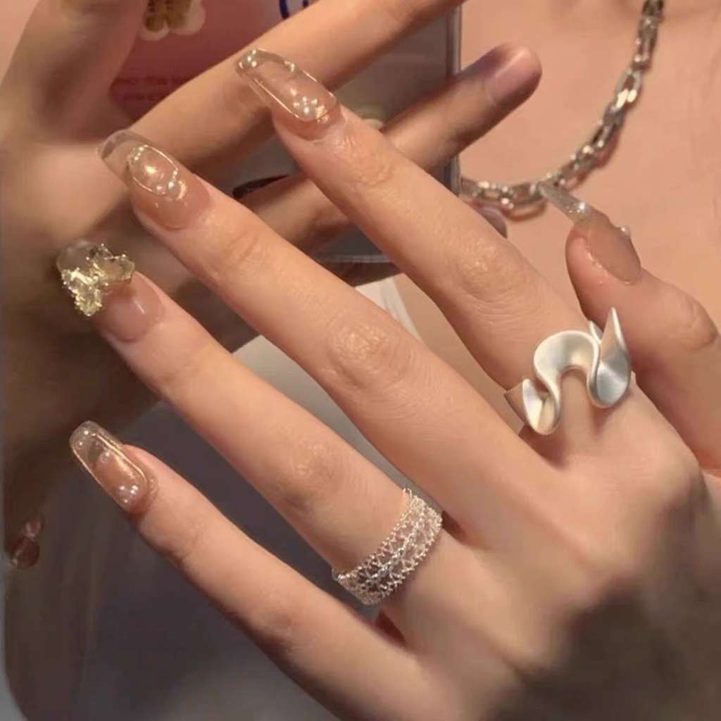Cincin Gaya Korea Desain Hollow Bergelombang Bahan Alloy Warna Silver Untuk Wanita