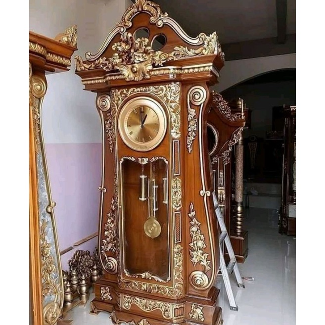 almari jam ukir brawijaya gandul modern klasik mewah kayu jati furniture mebel jepara