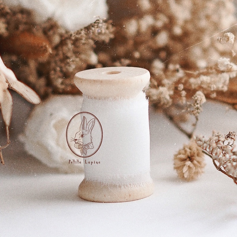 

Silk Ribbon Broken White *TANPA ROLL KAYU* | Wedding Styling Calligraphy Ribbon | Pita | Broken White by Petite Lapine