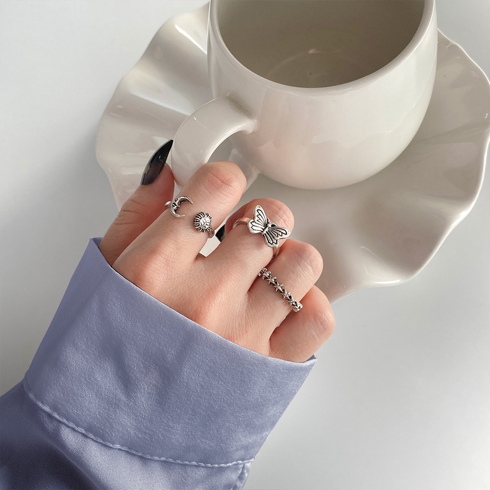 Set Cincin Model Terbuka Desain Bintang Kupu-Kupu Hollow Bahan Metal Warna Silver Gaya Korea Untuk Wanita