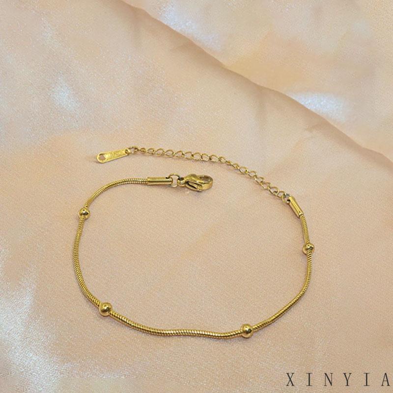 Xia.id Gelang Tangan Titanium Steel Desain Tulang Ular Hias Manik Bulat Untuk Wanita