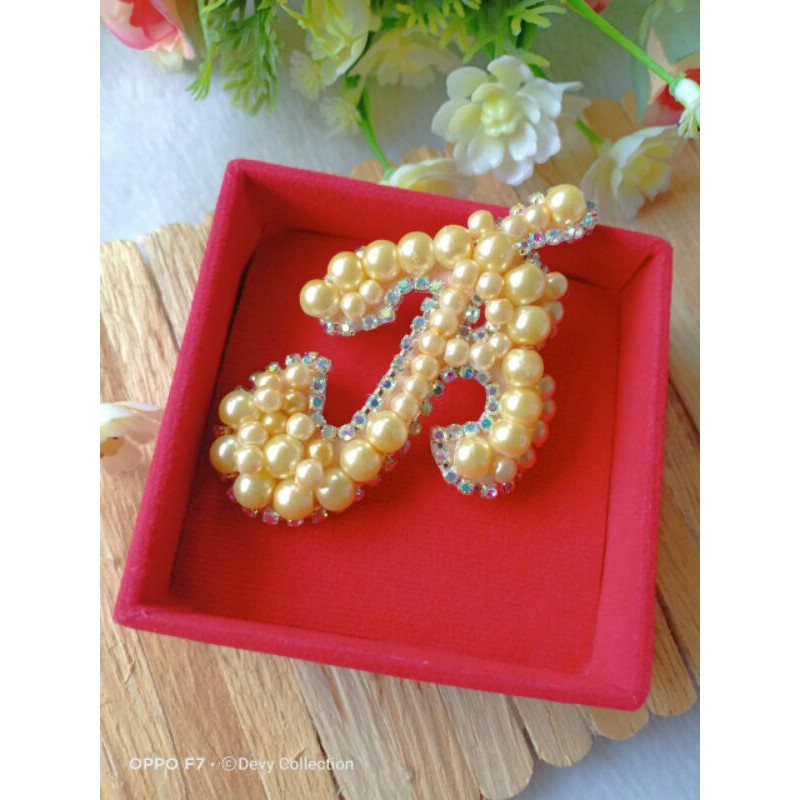 Bros huruf mutiara diamont