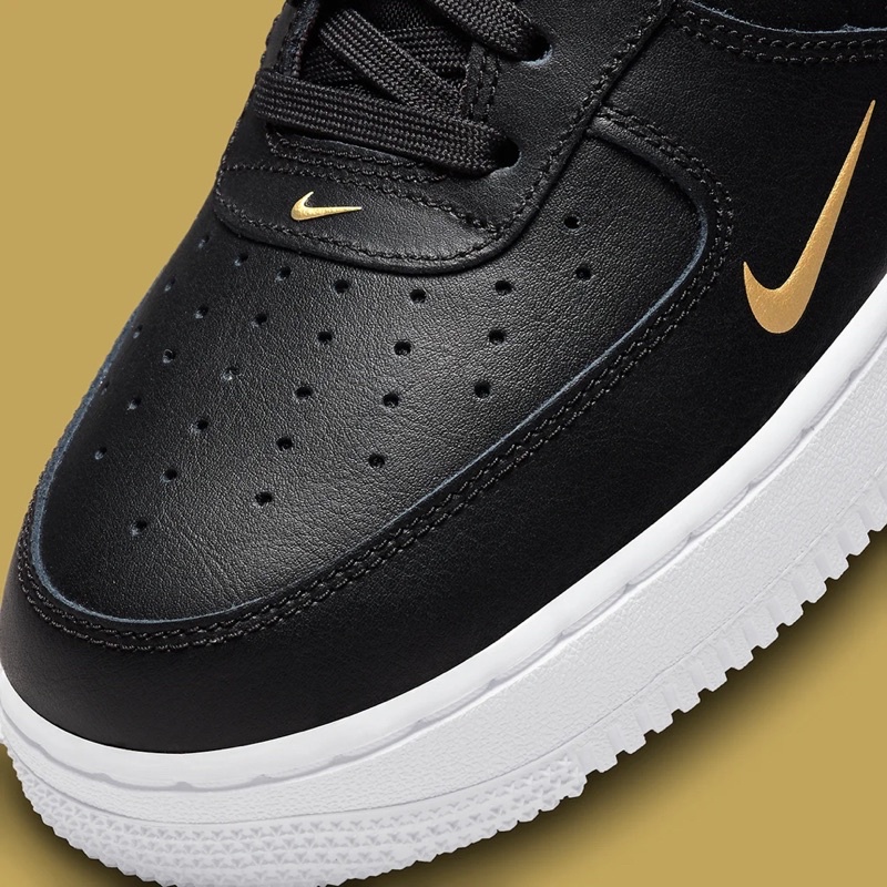 black air forces gold swoosh