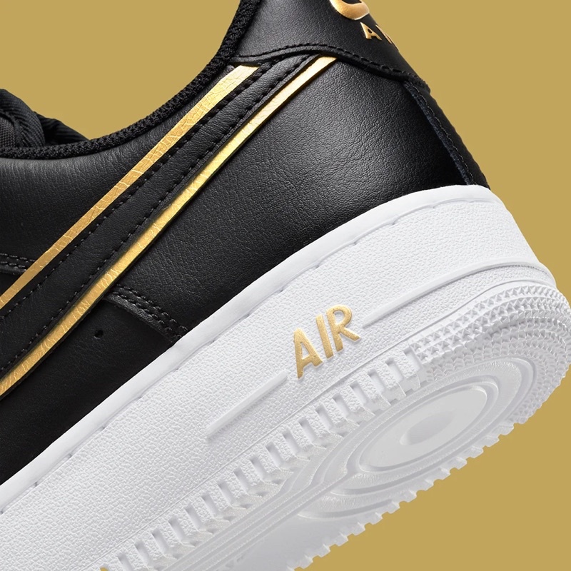 black air forces gold swoosh