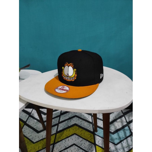 ▶️بِسْــــــــــــــــــــــمِ اللّهِ الرَّحْمَنِ الرَّحِيْ✅➡️ BRAND NEW ERA x GARFIELD SNAPBACK