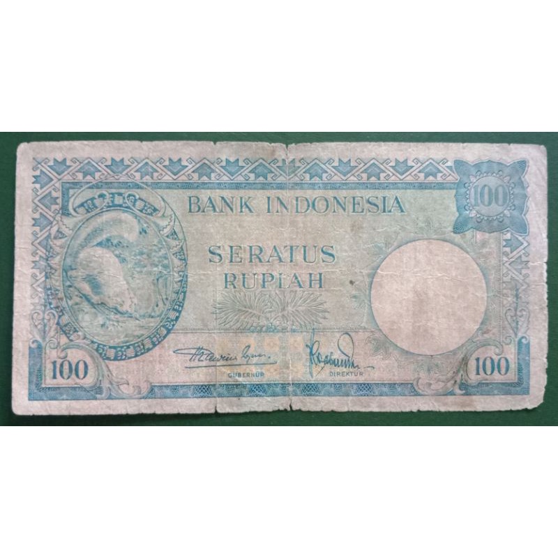 UANGKUNO 100 RUPIAH TUPAI THN 1957
