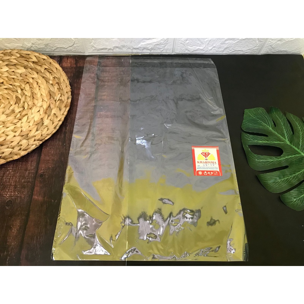 PLASTIK OPP 30X40 DENGAN LEM / SEAL BUNGKUS / PACKING BAJU, GARMENT DLL ISI 100 LBR