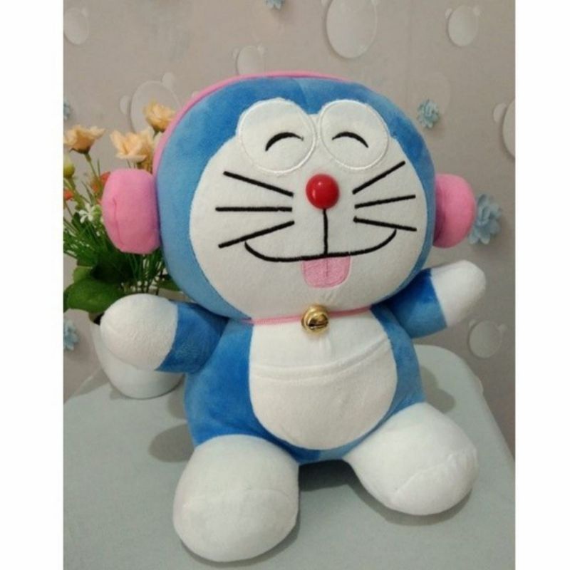 Boneka Doraemon lucu pake headshet