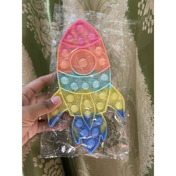 POP IT Rainbow karakter BT21 ice cream mobil dino - Hadiah kado Mainan Anak-Roket