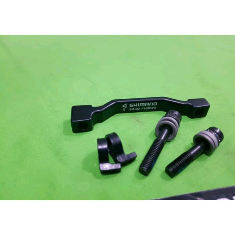 ORIGINAL SHIMANO ADAPTOR ROTOR CALIPER 7 INCH 180 MM POST MOUNT . ADAPTER KALIPER PIRINGAN SEPEDA REM DISCBRAKE 7INCH 180MM PM POST MOUNT BISA FRONT REAR DEPAN BELAKANG SEPEDA MTB FOLDING BIKE MOUNTAIN GUNUNG