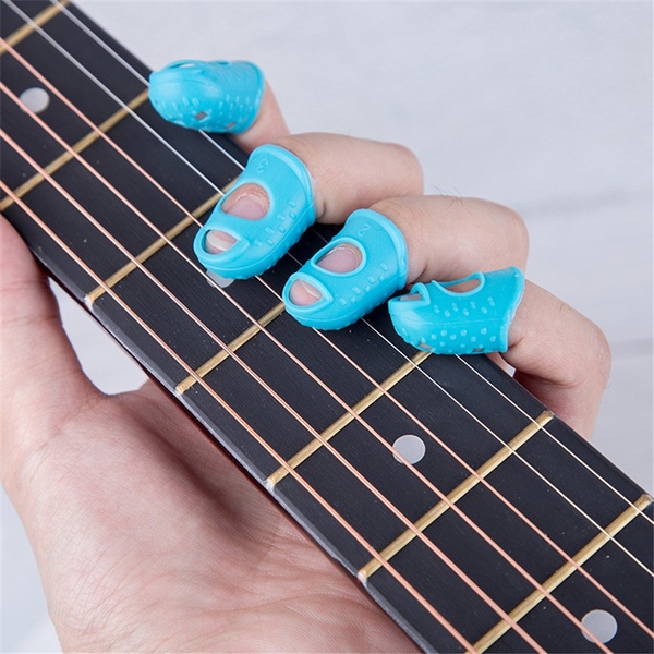 Pelindung Jari 1 Set isi 4 Pcs Warna Warni Silikon Jari Silicon Hitam Biru Muda Pink Abu Kuning Gitar Ukulele Kalimba