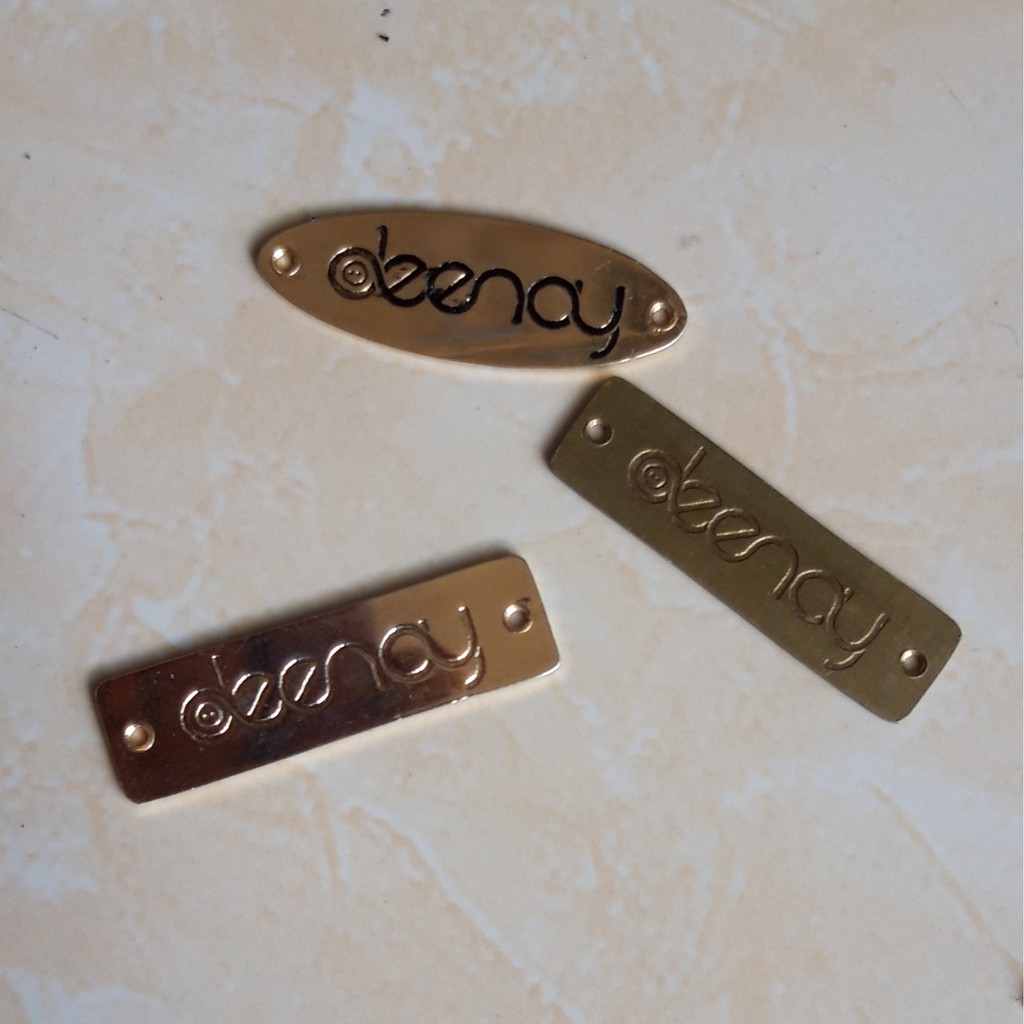 

label plat hijab bahan kuningan dan stainless