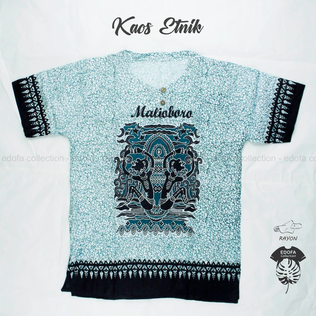 Kaos Etnik Jogja Malioboro Pria Wanita Motif Asmat Warna Tosca (Latar Putih)