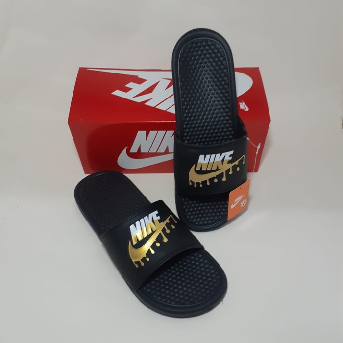 red nike slides gold swoosh