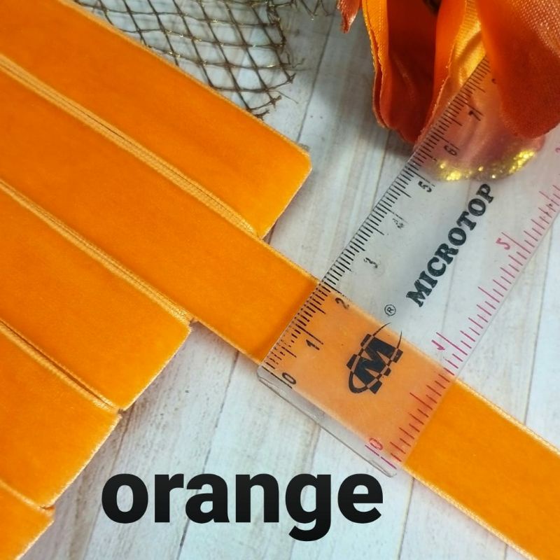 

per rol 15 meter,pita bludru/velvet warna orange lebar 2 cm