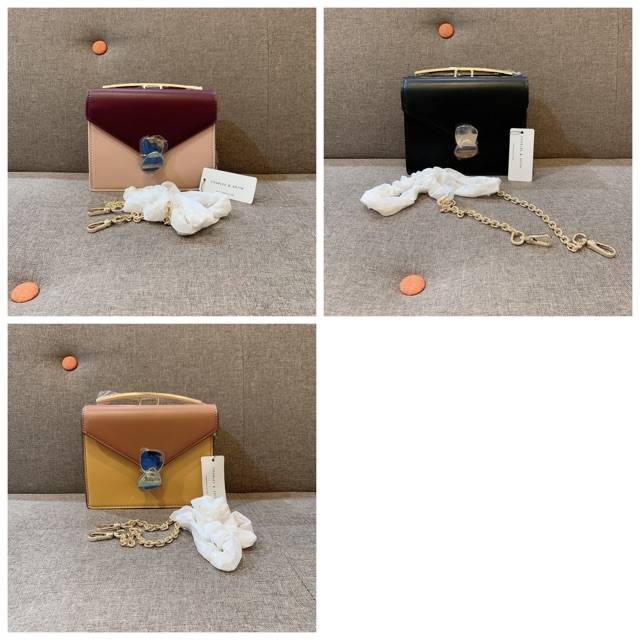 Tas two tune metallic push lock top handle bag