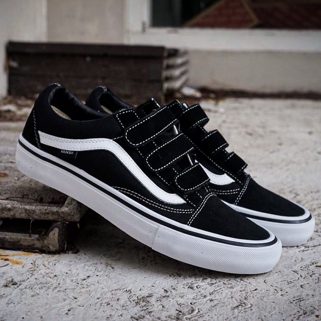 white leather vans with black stripe