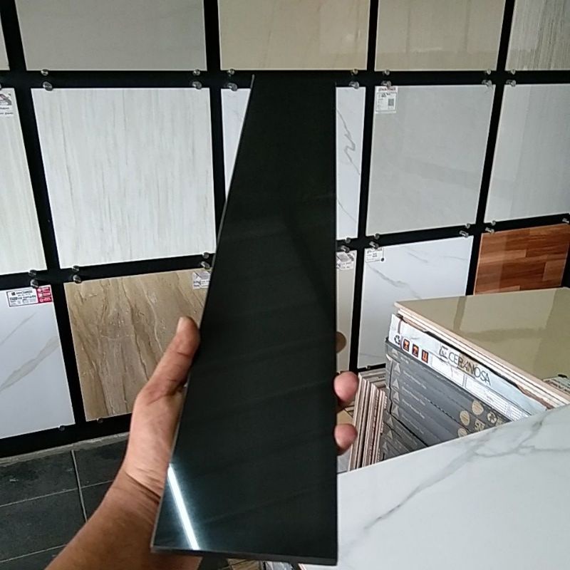 plin granit 10x60 hitam polos