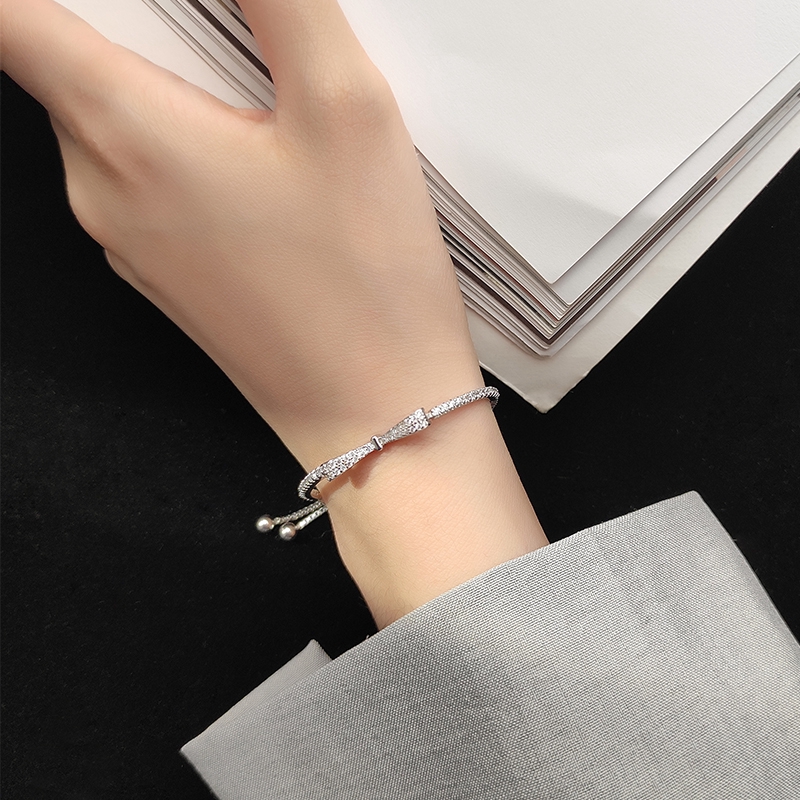 Gelang Tangan Silver Wanita Desain Pita Hias Zircon Adjustable Untuk Hadiah Ulang Tahun