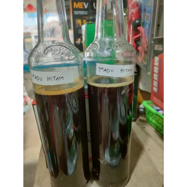 

madu hitam hutan asli