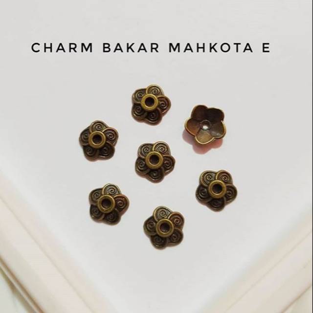Charm bakar mahkota E