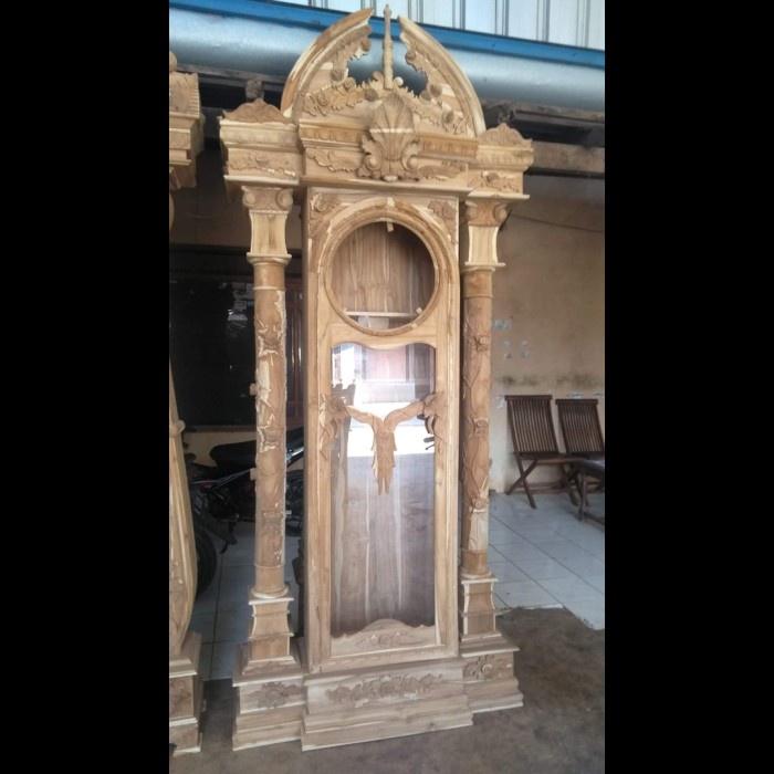 LEMARI JAM JATI UKIR UKIR BRAWIJAYA