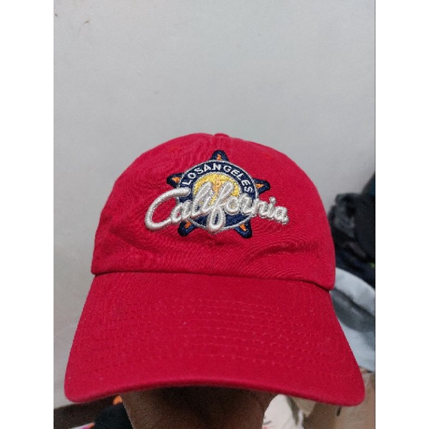 topi import bekas
