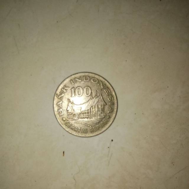 Uang kuno 100 rupiah tipis. Tahun 1978. Wayang, rumab gadang