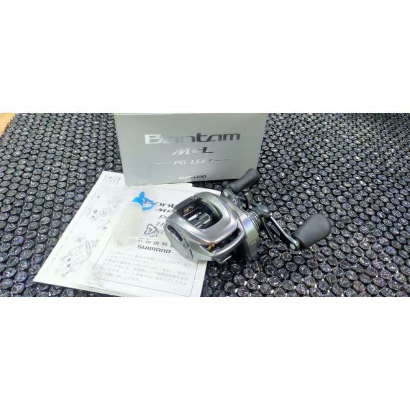 Reel BC SHIMANO BANTAM MGL PG LEFT HANDLE GARANSI RESMI 1 TAHUN