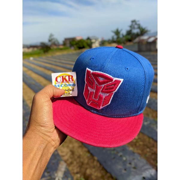 Topi pria original branded snapback NEW ERA X TRANSFORMERS