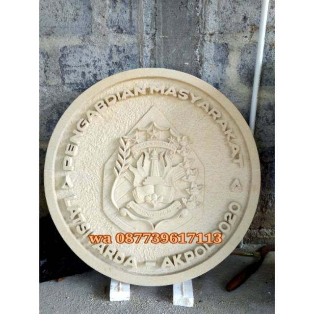 ornamen logo hiasan dinding batu ukir