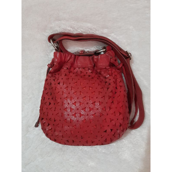 tas fossil drawstring lasercut red preloved
