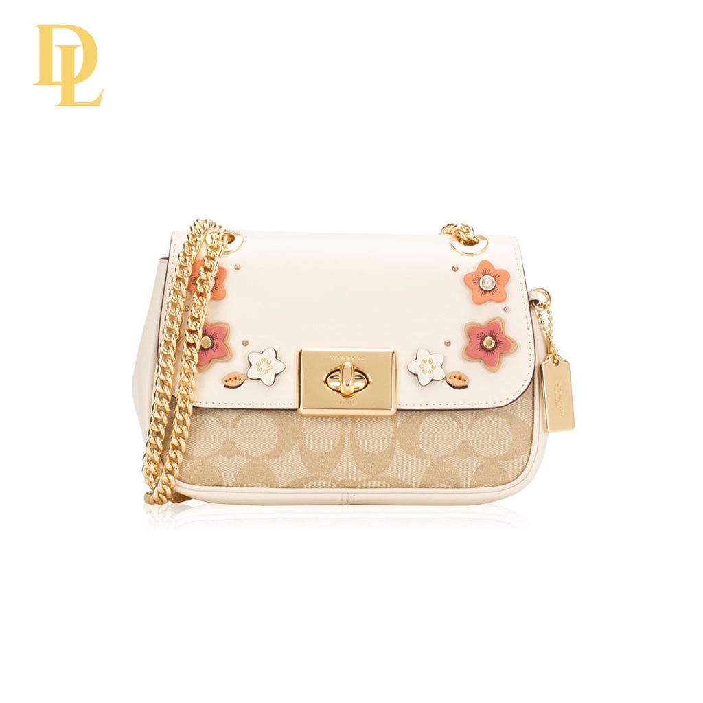 MINI CASSIDY CROSSBODY IN SIGNATURE CANVAS WITH FLORAL APPLIQUE (COACH F73057)