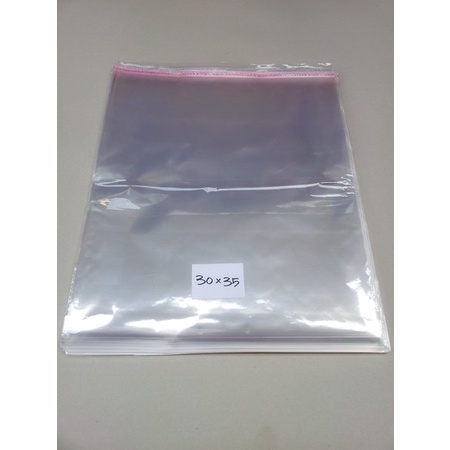 

Plastik Opp 30X35 Seal/Lem (Isi 100 Lembar)/Opp jaket/Opp tebal