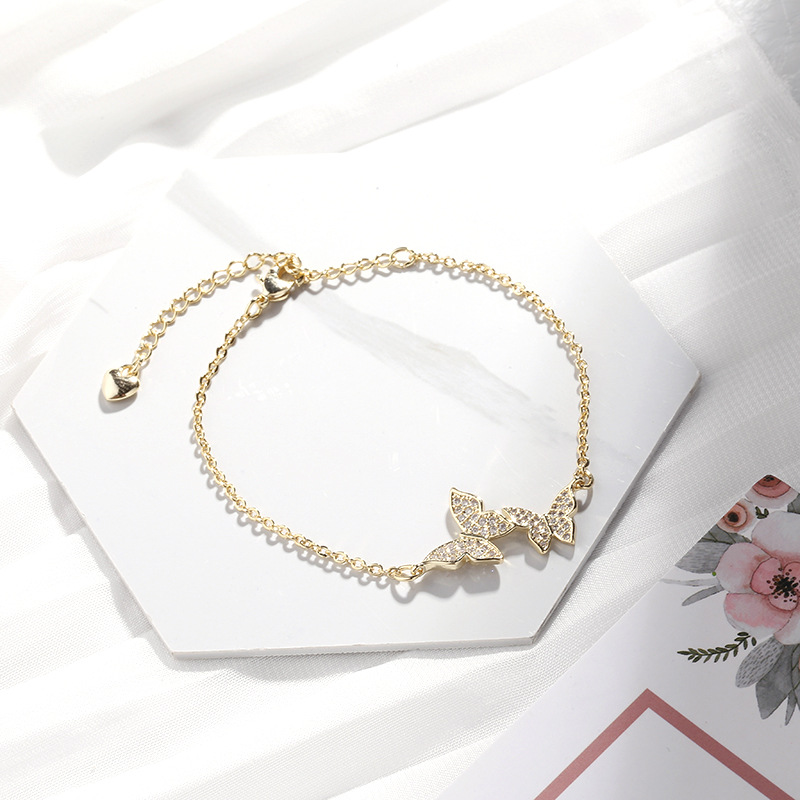 Gelang Rantai Desain Double Butterfly Bahan Cubic Zirconia Warna Emas Untuk Wanita