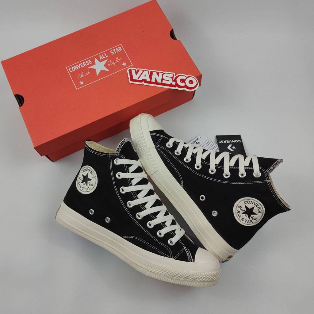 white converse with rainbow sole