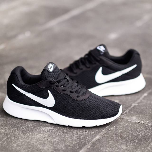 nike tanjun size 4