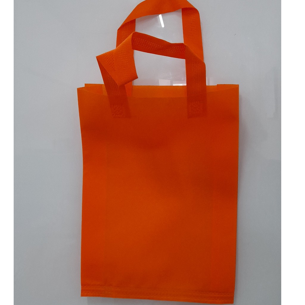 

Tas Press Spunbound Tali Goodie Bag Tas Belanja Warna Orens 30 cm x 40 cm