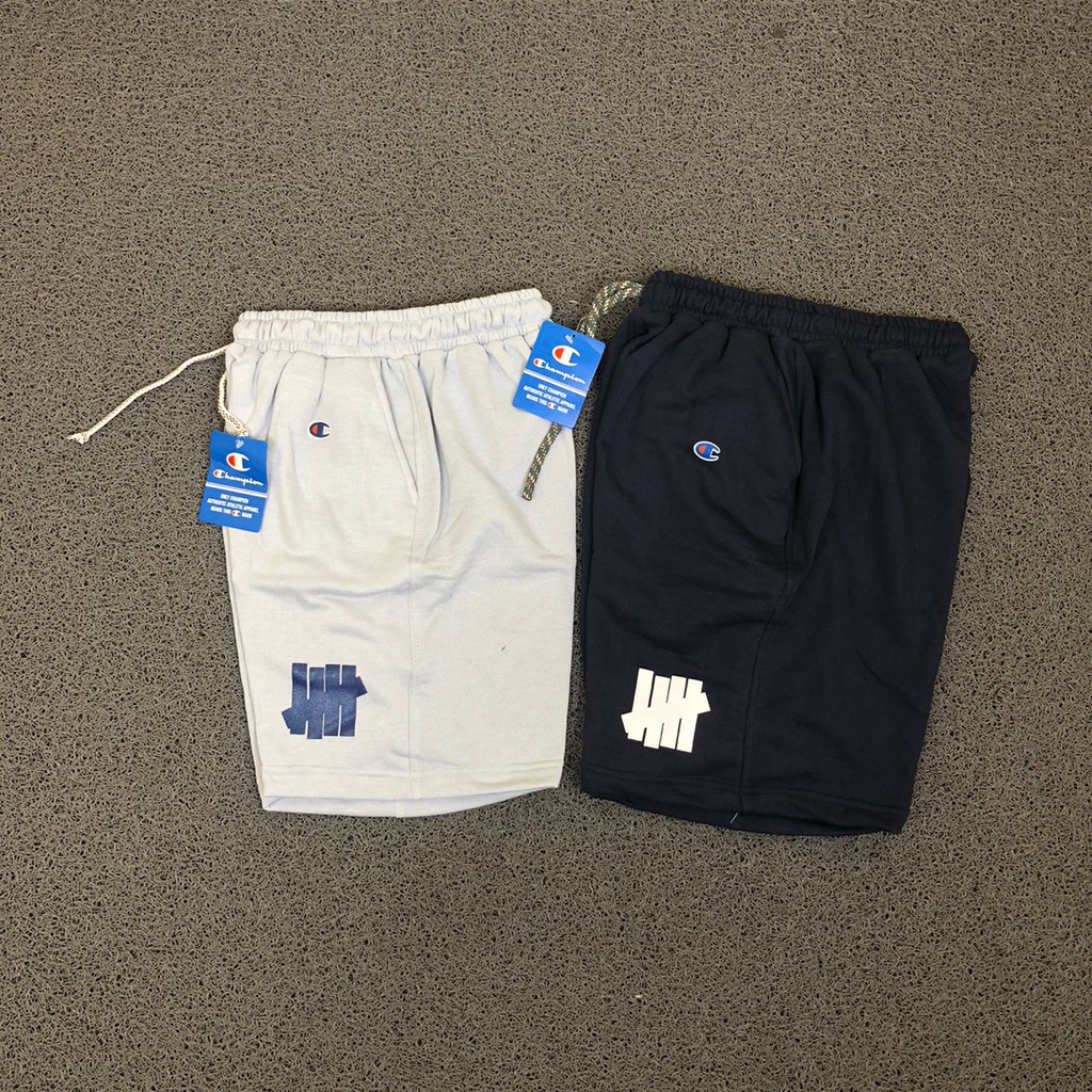 SHORTPANTS CELANA PENDEK UNISEX UNDEFEATED LOGO SIDE SOFT GREY