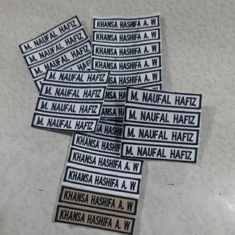 

PAPAN NAMA BORDIR, NAME TAG, NAMA SEKOLAH, NAMA SISWA, NAMA DADA, BORDIR NAMA BORDIRAN KOMPUTER