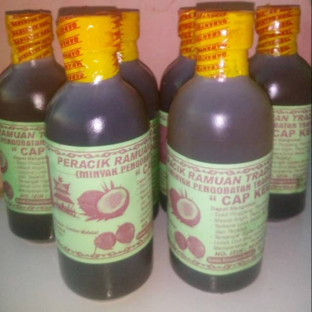 

Minyak urut Tradisional Karo Cap kelapa Hijau 250ml