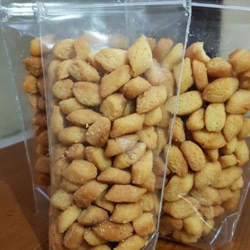 

SNACK BIJI KETAPANG CEMILAN KHAS LEBARAN OLEH OLEH JAJANAN MANIS LEGENDARIS KUE KERING ADAS