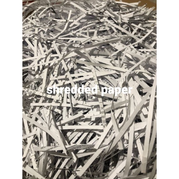 

paper shredded, kertas cacah, serut (50 gr), warna putih untuk packing terhindar goncangan