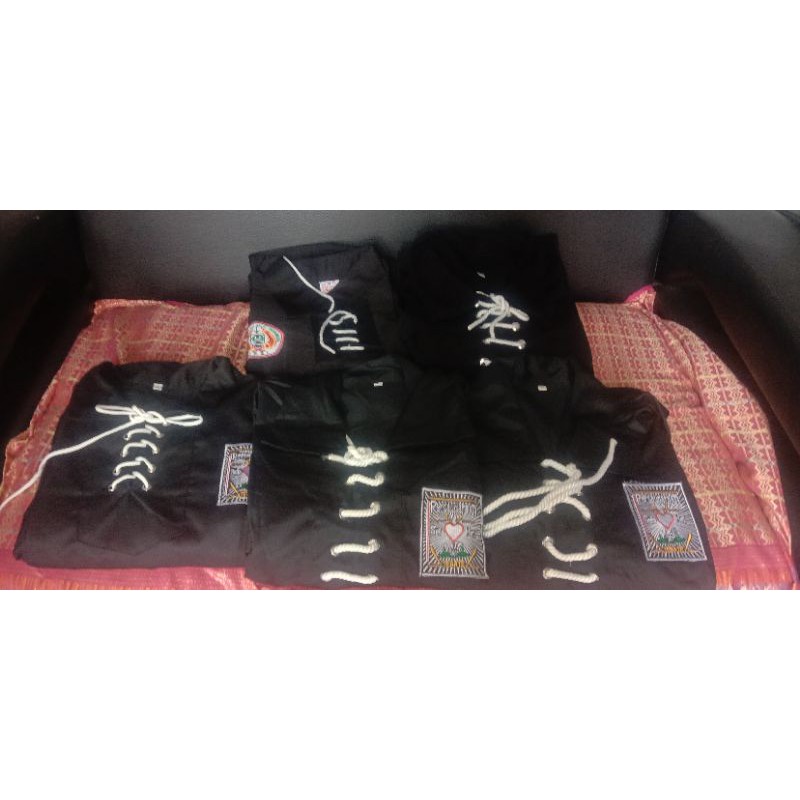 Baju sakral warga psht bahan Jetblack.