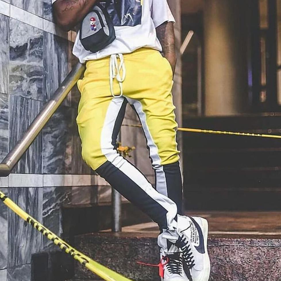 yellow black and white track pants