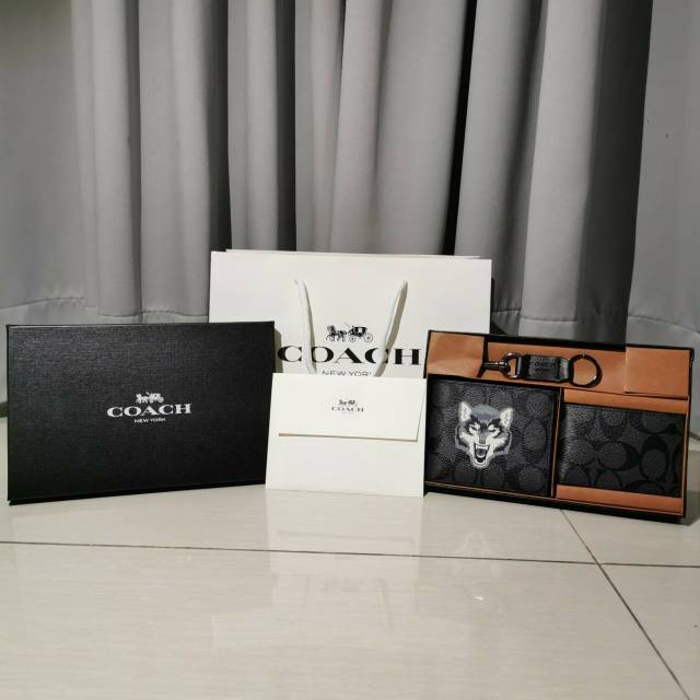 harga coach wallet wolf original