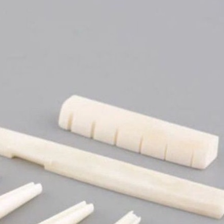 Saddle nut gitar akustik