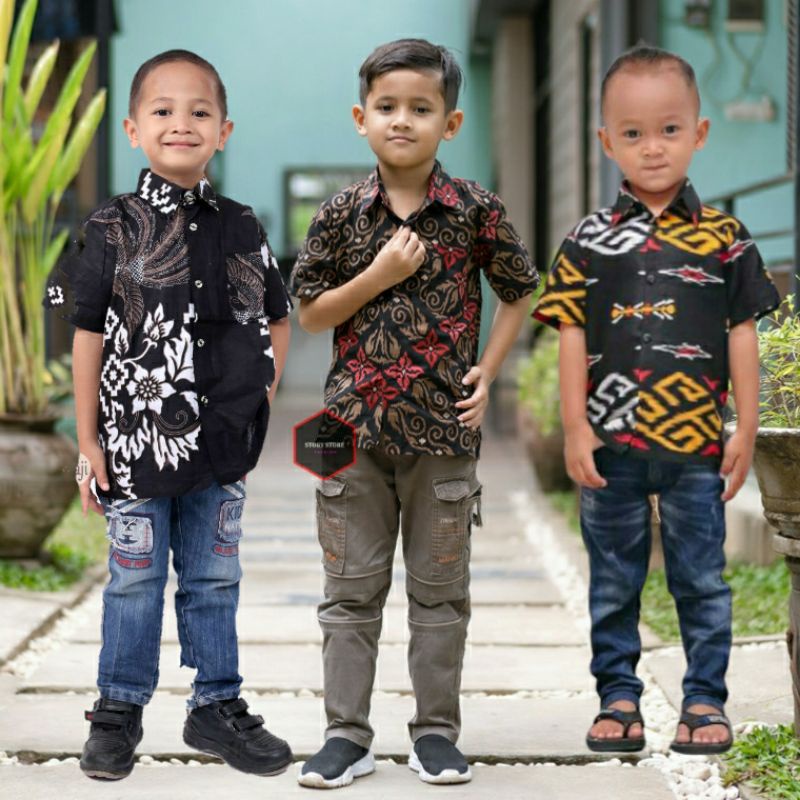 HEM BATIK ANAK BAJU ANAK USIA BALITA SATU TAHUN 1 2 3 4 5 6 7 8 9 10 11 12 13 14TAHUN REMAJA KEMEJA LENGAN PENDEK BATIK MOTIF MEGA MENDUNG HITAM SONGKET MERAH ZIGZAG SONGKET BALI ADABI ABU BOROBUDUR SOGAN BOROBUDUR HITAM PUTIH MODERN MURAH